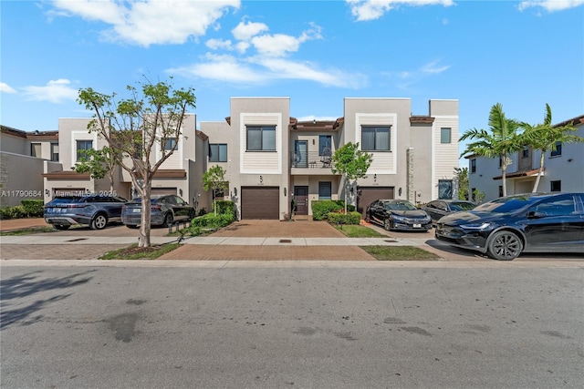 21364 NE 2nd Ct, Miami, FL 33179 - townhome / multi-family property with a residential view, concrete driveway, and stucco siding