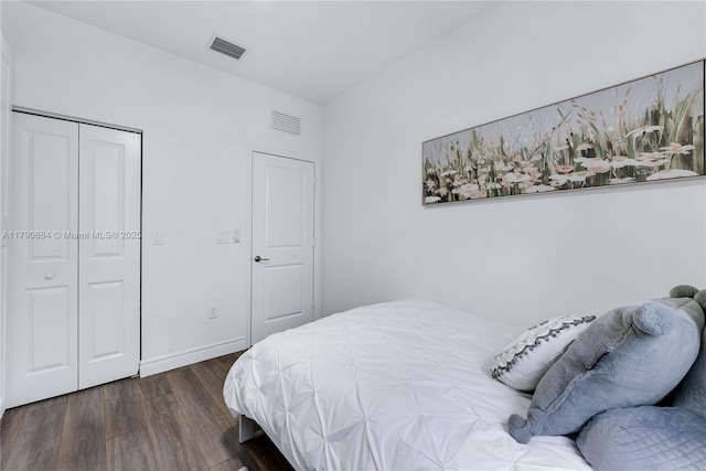 21364 NE 2nd Ct, Miami, FL 33179 - bedroom with baseboards, visible vents, wood finished floors, and a closet