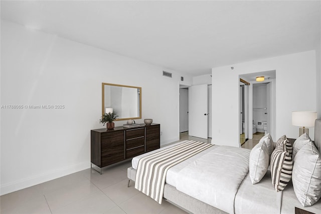 bedroom with light tile patterned flooring, visible vents, and baseboards