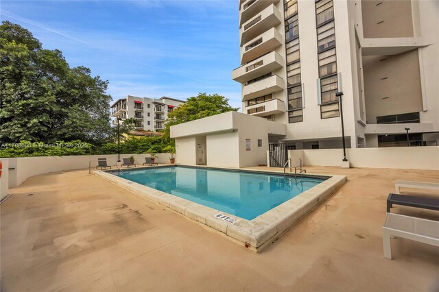 community pool with a patio