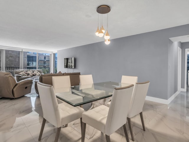 2101 S Ocean Dr Unit 401, Hollywood, FL 33019 - dining room with marble finish floor, expansive windows, and baseboards