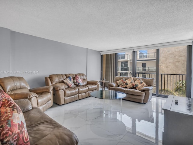 2101 S Ocean Dr Unit 401, Hollywood, FL 33019 - living room with a textured ceiling, floor to ceiling windows, and marble finish floor