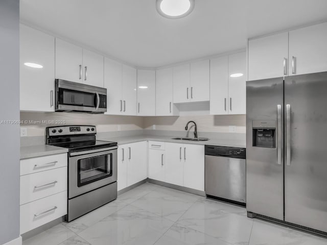 2101 S Ocean Dr Unit 401, Hollywood, FL 33019 - kitchen featuring marble finish floor, a sink, appliances with stainless steel finishes, and light countertops