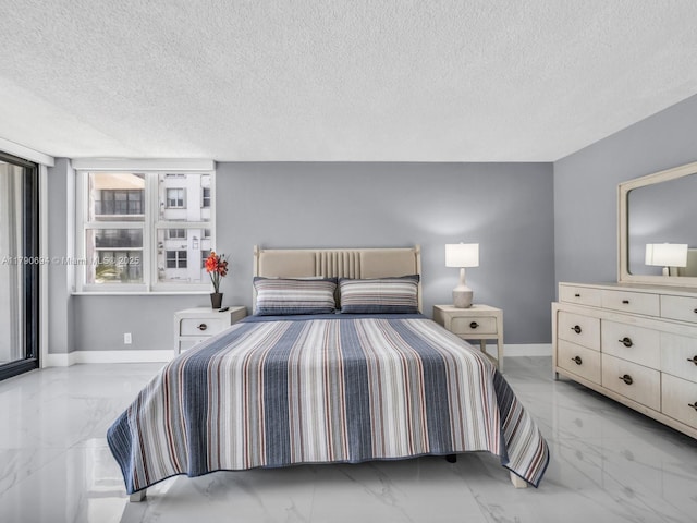 2101 S Ocean Dr Unit 401, Hollywood, FL 33019 - bedroom featuring marble finish floor, a textured ceiling, and baseboards