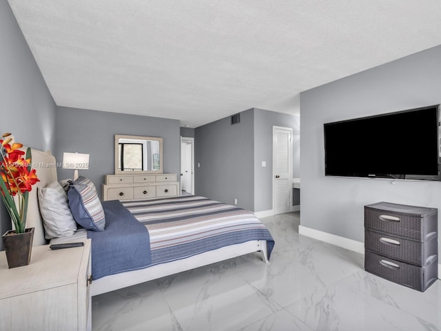 2101 S Ocean Dr Unit 401, Hollywood, FL 33019 - bedroom with marble finish floor, visible vents, a textured ceiling, and baseboards