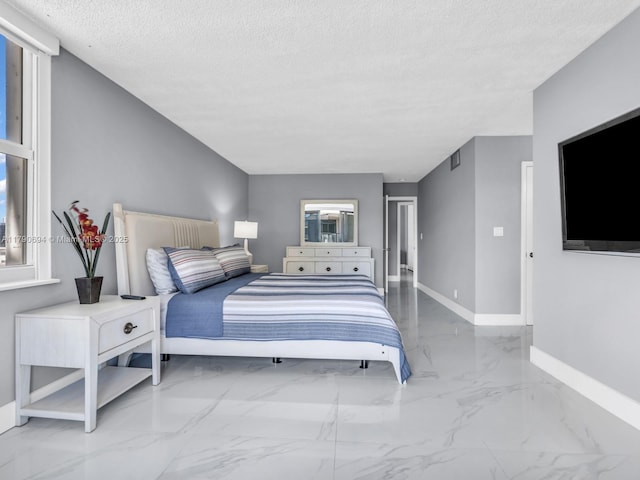 2101 S Ocean Dr Unit 401, Hollywood, FL 33019 - bedroom featuring baseboards, a textured ceiling, and marble finish floor