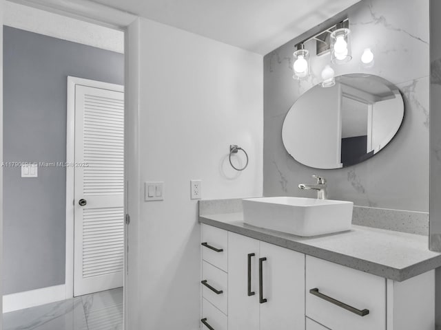2101 S Ocean Dr Unit 401, Hollywood, FL 33019 - bathroom featuring vanity, marble finish floor, and baseboards