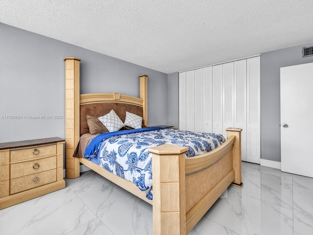 2101 S Ocean Dr Unit 401, Hollywood, FL 33019 - bedroom with a textured ceiling, visible vents, marble finish floor, and baseboards
