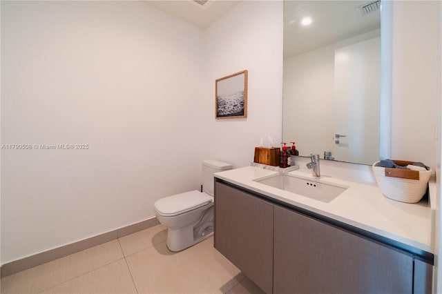 half bathroom with toilet, tile patterned floors, visible vents, and vanity