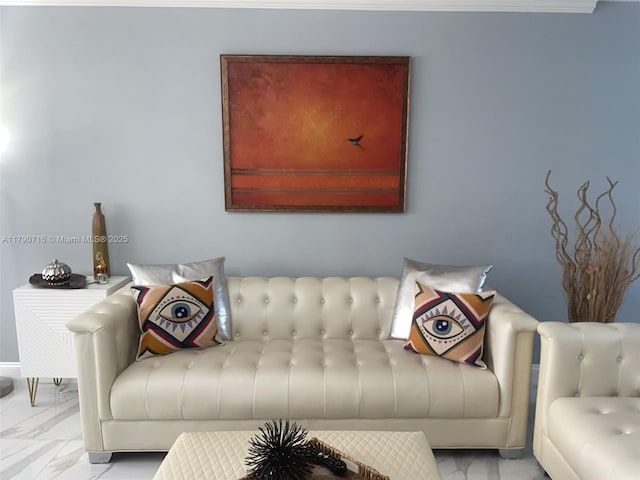 living area featuring marble finish floor and baseboards