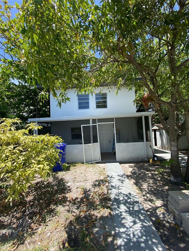 view of front of property with a sunroom