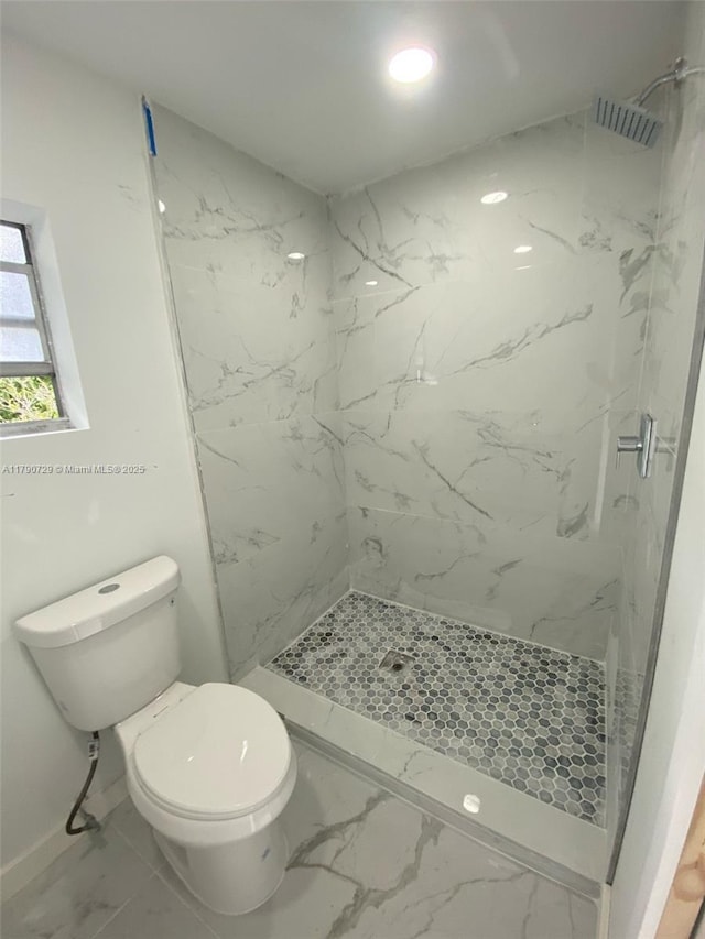 bathroom featuring a marble finish shower, toilet, and marble finish floor