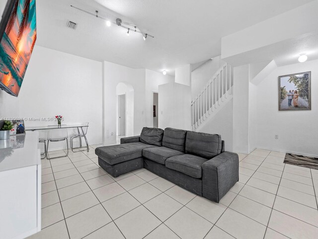 2352 SE 21st St, Homestead, FL 33035 - living room featuring baseboards, visible vents, and light tile patterned floors