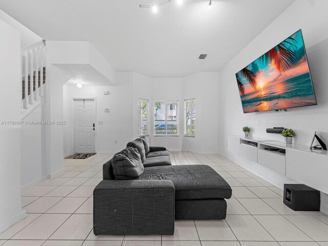 2352 SE 21st St, Homestead, FL 33035 - kitchen with light brown cabinets, dark countertops, stainless steel appliances, and light tile patterned floors