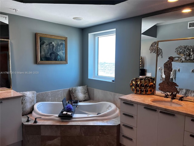 15051 Royal Oaks Ln Unit 2301, North Miami, FL 33181 - bathroom with vanity, a jetted tub, and a shower with door