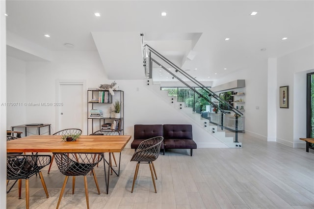 1311 Bay Dr, Miami Beach, FL 33141 - dining space featuring stairway, recessed lighting, light wood-style flooring, and baseboards