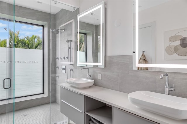 1311 Bay Dr, Miami Beach, FL 33141 - full bath featuring tile walls, a sink, and a shower stall