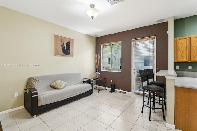 21421 NW 13th Ct Apt 211, Miami Gardens, FL 33169 - living area featuring baseboards, visible vents, and light tile patterned floors