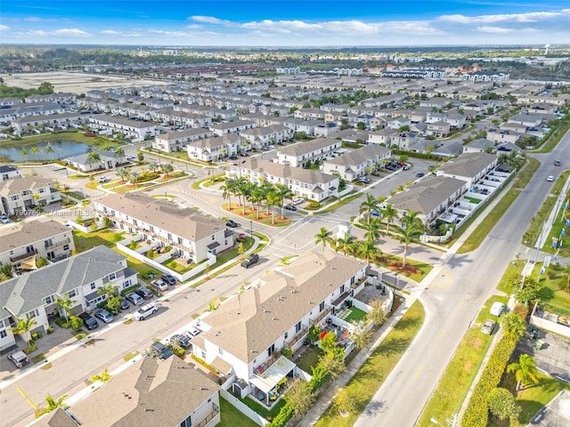 aerial view with a residential view and a water view