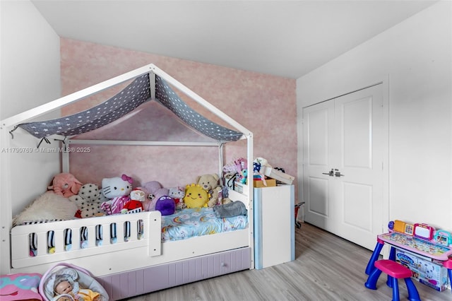 bedroom with wood finished floors