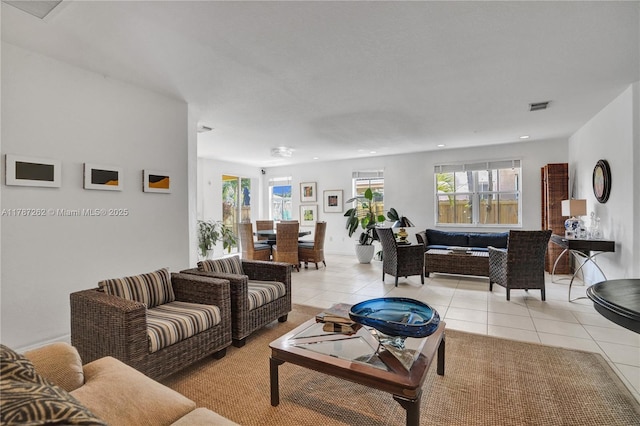 living room featuring visible vents, light tile patterned flooring, and recessed lighting