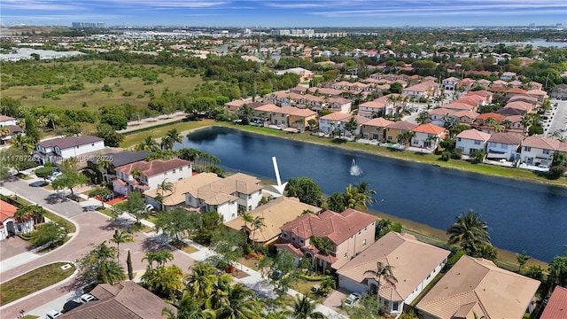 birds eye view of property featuring a water view and a residential view