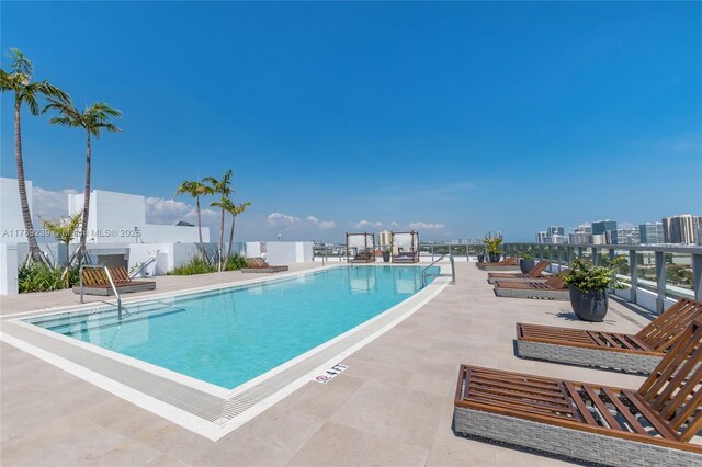9261 E Bay Harbor Dr Unit 606, Bay Harbor Islands, FL 33154 - pool with a patio and fence