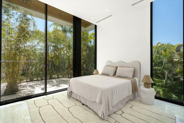 bedroom featuring a wall of windows