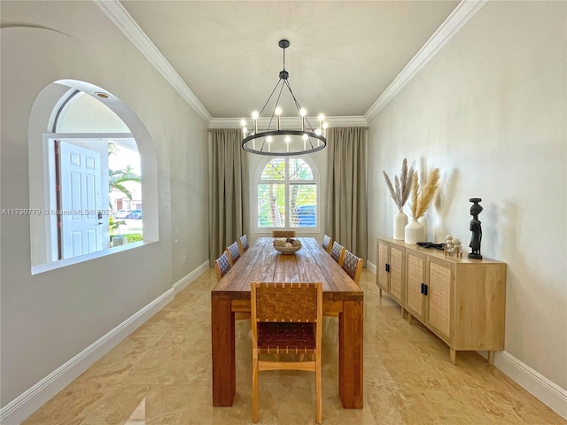 dining area with an inviting chandelier, baseboards, ornamental molding, and arched walkways