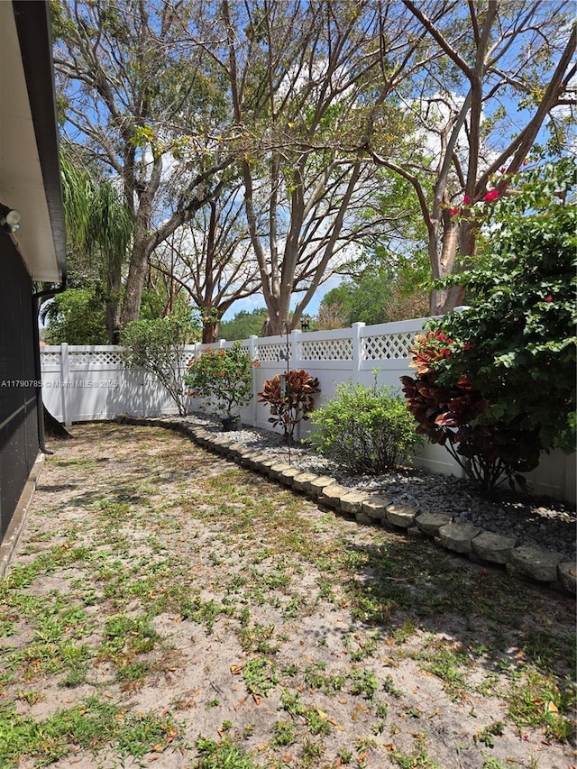 view of yard with a fenced backyard