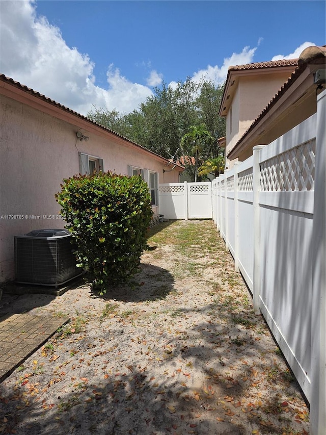 view of yard featuring cooling unit and a fenced backyard