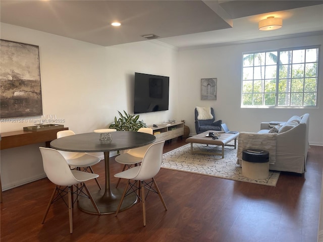 dining area featuring visible vents, wood finished floors, crown molding, and recessed lighting