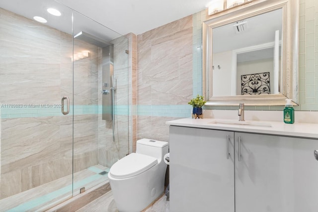 371 Fairway Cir Unit 56, Weston, FL 33326 - bathroom featuring visible vents, a stall shower, toilet, tile walls, and vanity