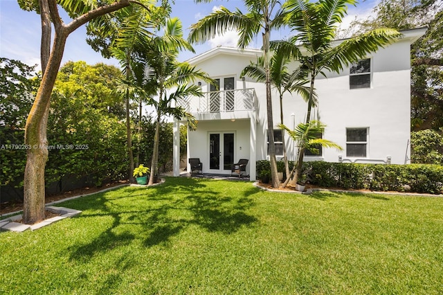 3648 Oak Ave, Coconut Grove, FL 33133 - back of property with french doors, stucco siding, a lawn, and a balcony
