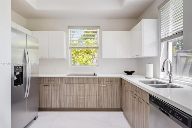 3648 Oak Ave, Coconut Grove, FL 33133 - kitchen featuring light countertops, stainless steel appliances, a sink, and modern cabinets
