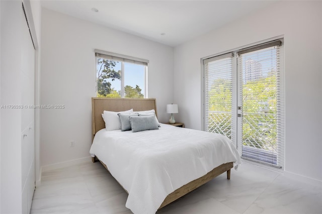 3648 Oak Ave, Coconut Grove, FL 33133 - bedroom featuring baseboards and access to exterior