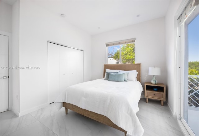 3648 Oak Ave, Coconut Grove, FL 33133 - bedroom with a closet, marble finish floor, and baseboards
