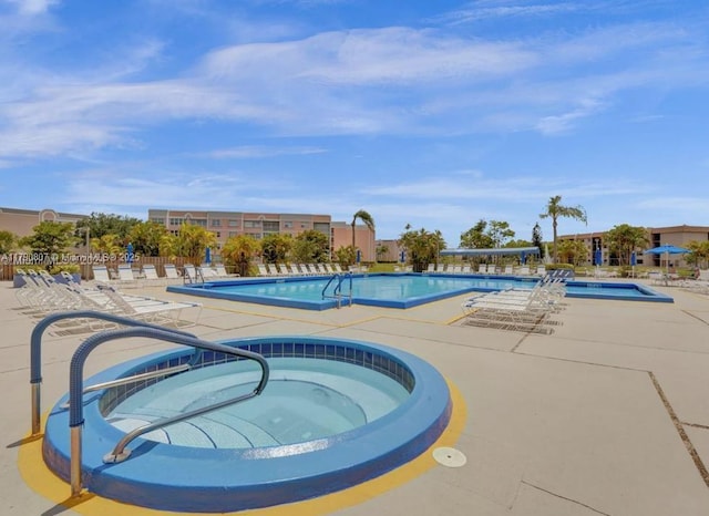 8400 Sunrise Lakes Blvd Unit 310, Sunrise, FL 33322 - community pool with a hot tub and a patio area