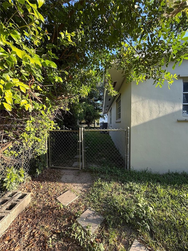 view of yard featuring fence and a gate