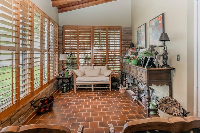 sitting room with vaulted ceiling and plenty of natural light
