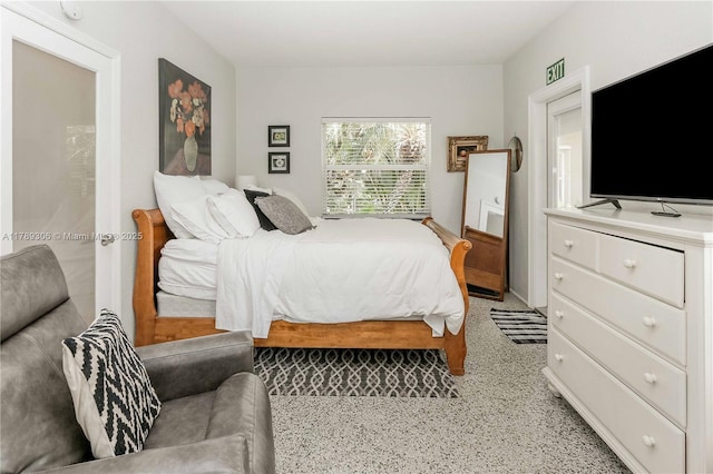 bedroom featuring light speckled floor