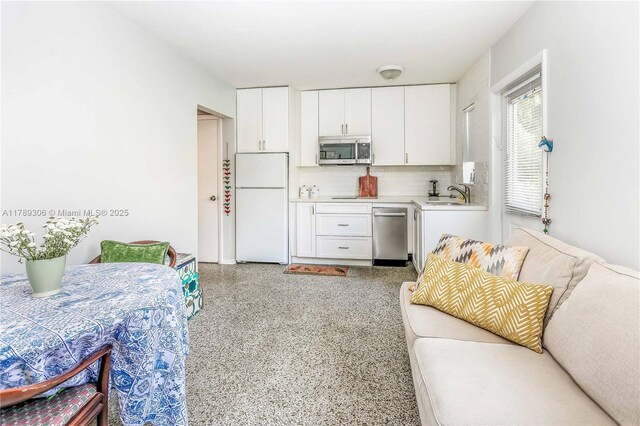 living room featuring light speckled floor