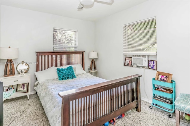 bedroom featuring ceiling fan and baseboards