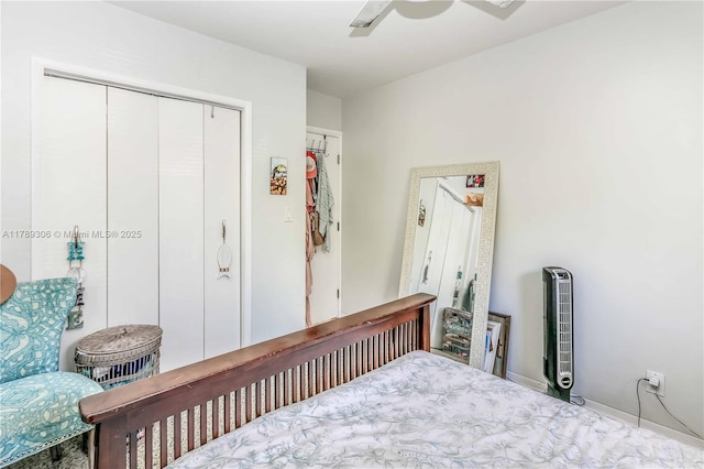bedroom with ceiling fan and a closet
