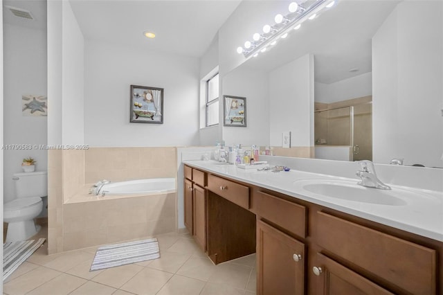 full bathroom featuring a shower stall, a sink, visible vents, a garden tub, and tile patterned flooring