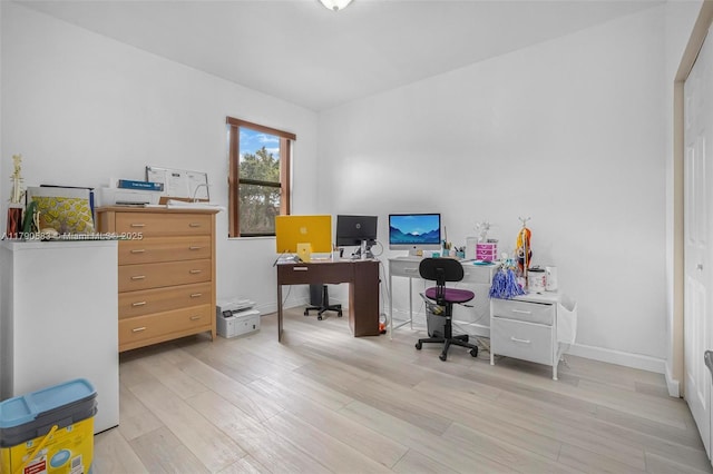 home office with light wood-type flooring