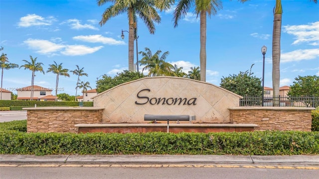 community sign with fence