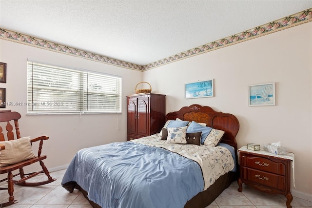 5300 Washington St Unit J116, Hollywood, FL 33021 - bedroom featuring baseboards, light tile patterned floors, and a textured ceiling