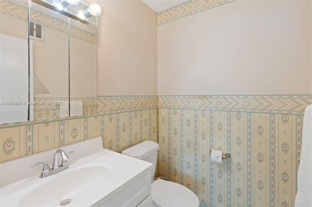 5300 Washington St Unit J116, Hollywood, FL 33021 - bathroom with toilet, a wainscoted wall, visible vents, and vanity