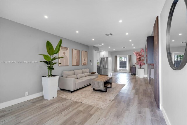 181 SW 76th Ter, Margate, FL 33068 - living room with baseboards, visible vents, light wood-type flooring, and recessed lighting